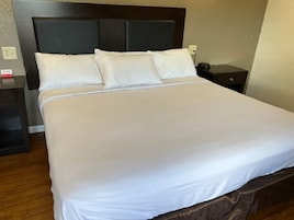 Basic Room | Desk, laptop workspace, bed sheets