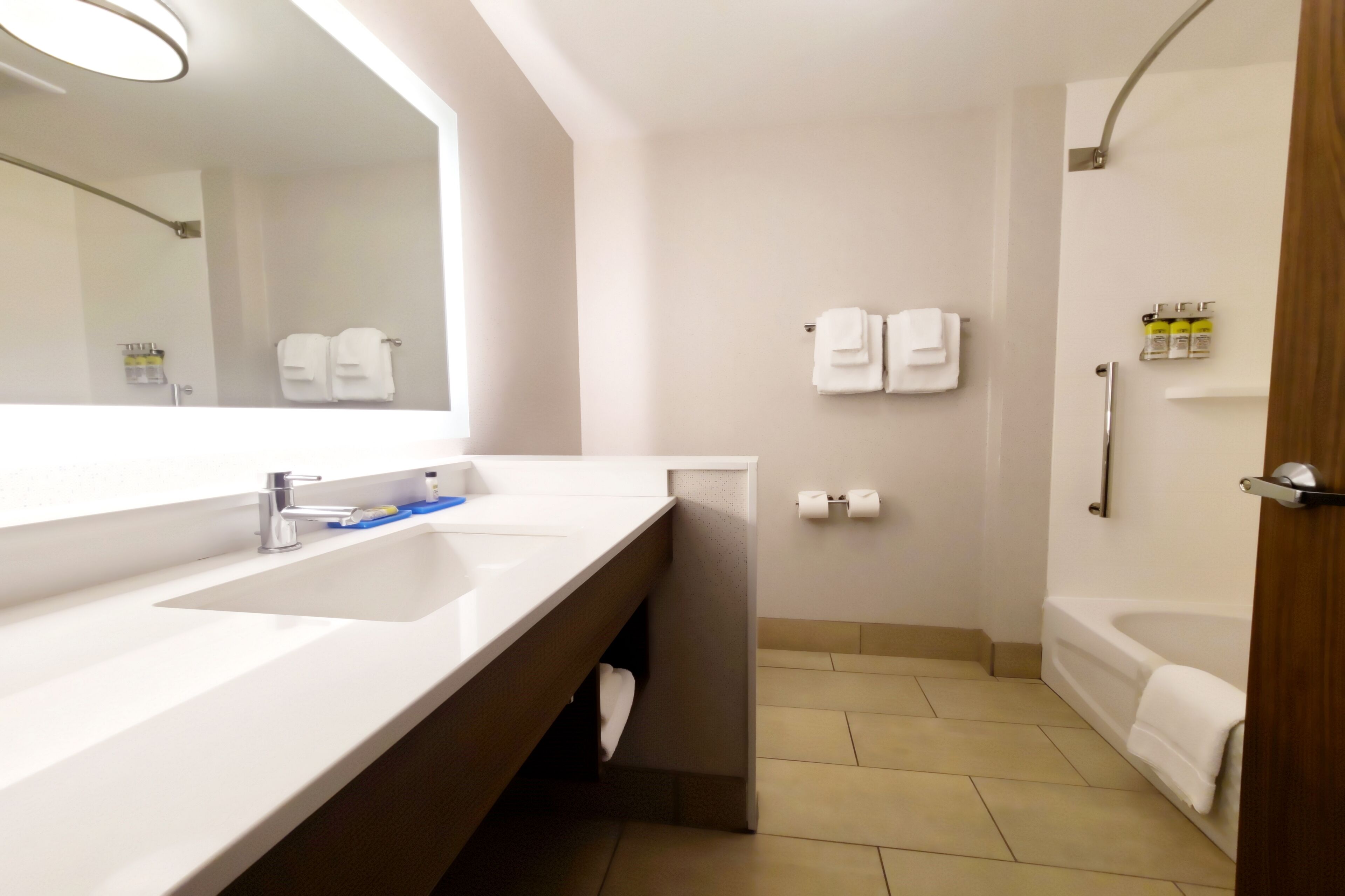 designer toiletries, hair dryer, towels