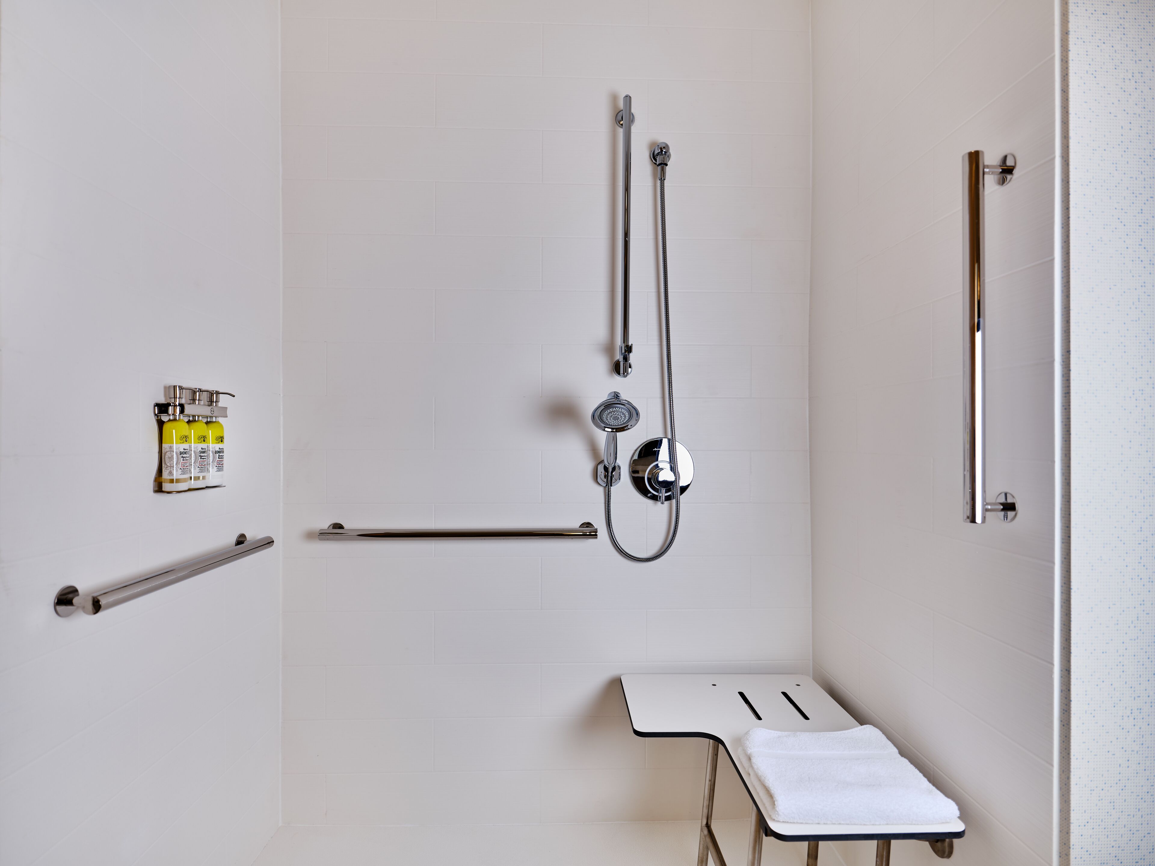 designer toiletries, hair dryer, towels