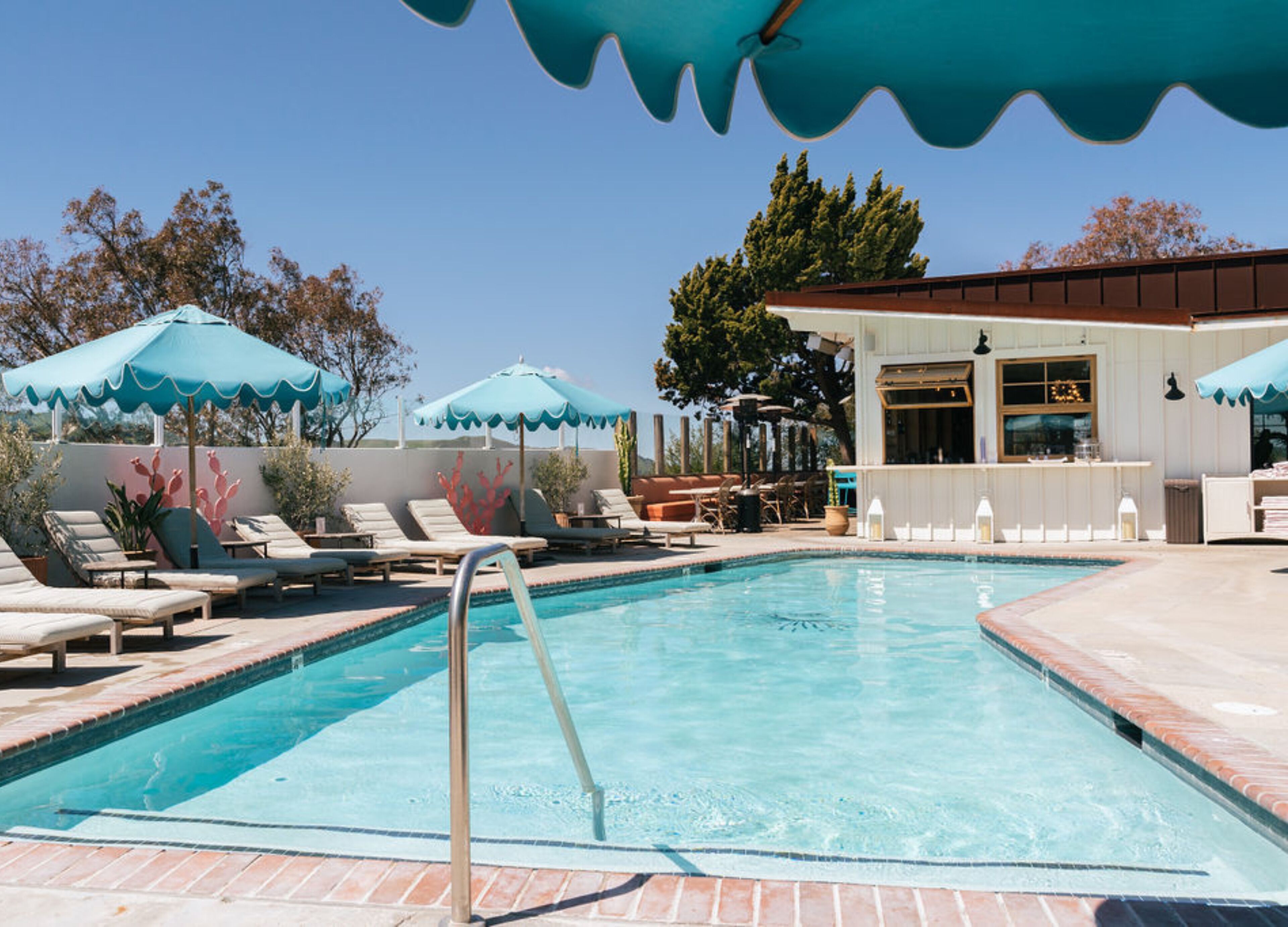 outdoor pool, open 9:00 am to 9:00 pm, pool umbrellas, pool loungers