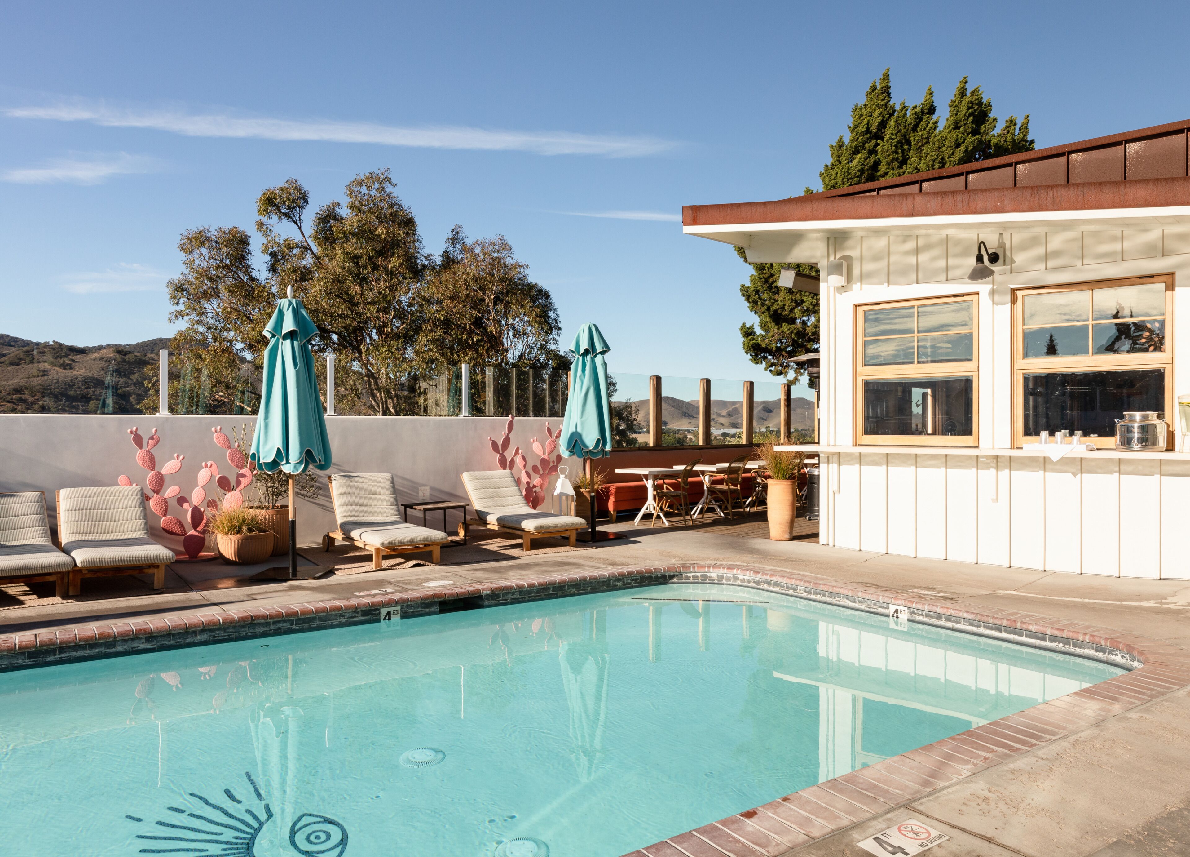 outdoor pool, open 9:00 am to 9:00 pm, pool umbrellas, pool loungers