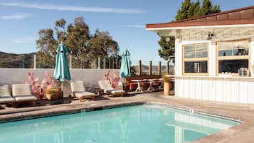 Outdoor pool, open 9:00 AM to 9:00 PM, pool umbrellas, sun loungers