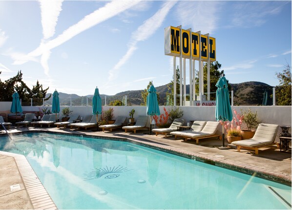Outdoor pool, open 9:00 AM to 9:00 PM, pool umbrellas, sun loungers