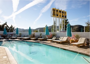 Outdoor pool, open 9:00 AM to 9:00 PM, pool umbrellas, sun loungers