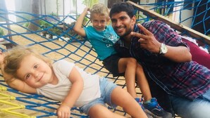 A hammock with three people.