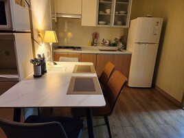 Fridge, microwave, stovetop, coffee/tea maker