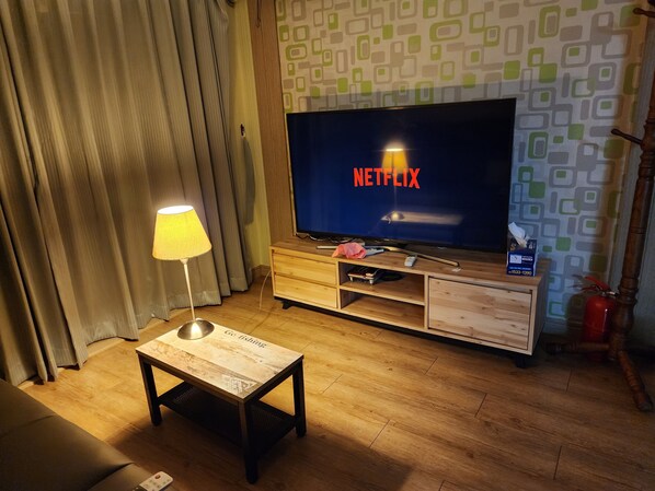 55-inch flat-screen TV with cable channels, TV, fireplace