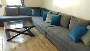 Apartment, 2 Bedrooms | Living room | Flat-screen TV