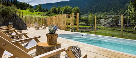 Outdoor pool, open 5:00 PM to 8:30 PM, pool loungers