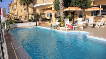Seasonal outdoor pool, a rooftop pool, sun loungers