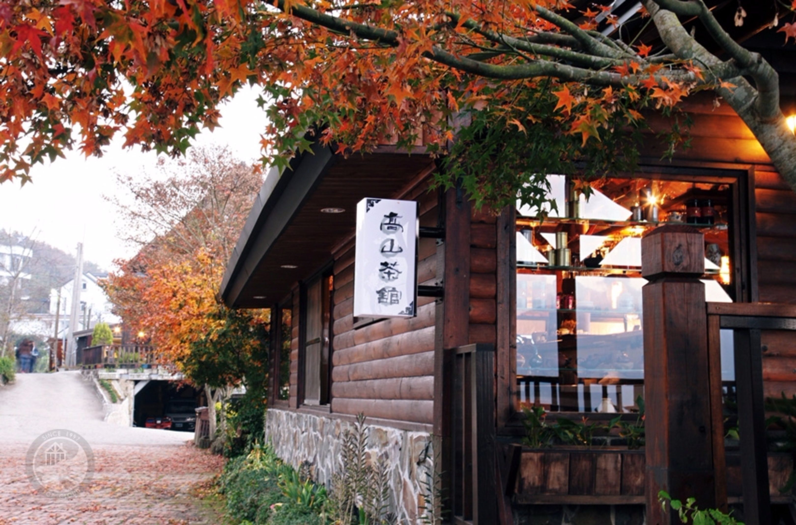 A wooden building with a sign that reads "high quality lodging."