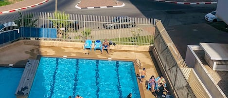 Seasonal outdoor pool, pool umbrellas, sun loungers