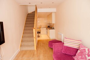 Comfort House, 1 Bedroom | Living area | Flat-screen TV