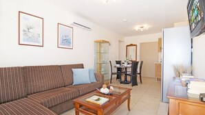Apartment | Living area | 42-inch TV with satellite channels, DVD player - Bay View Apartment (Paralimni)