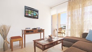 Apartment | Living area | 42-inch TV with satellite channels, DVD player - Bay View Apartment (Paralimni)