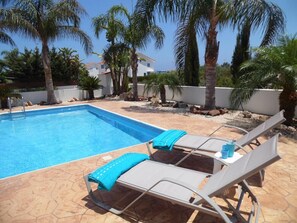 Outdoor pool, pool umbrellas, pool loungers