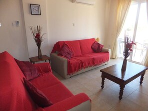 Appartement | Coin séjour | Télévisions à écran plasma, lecteur de DVD