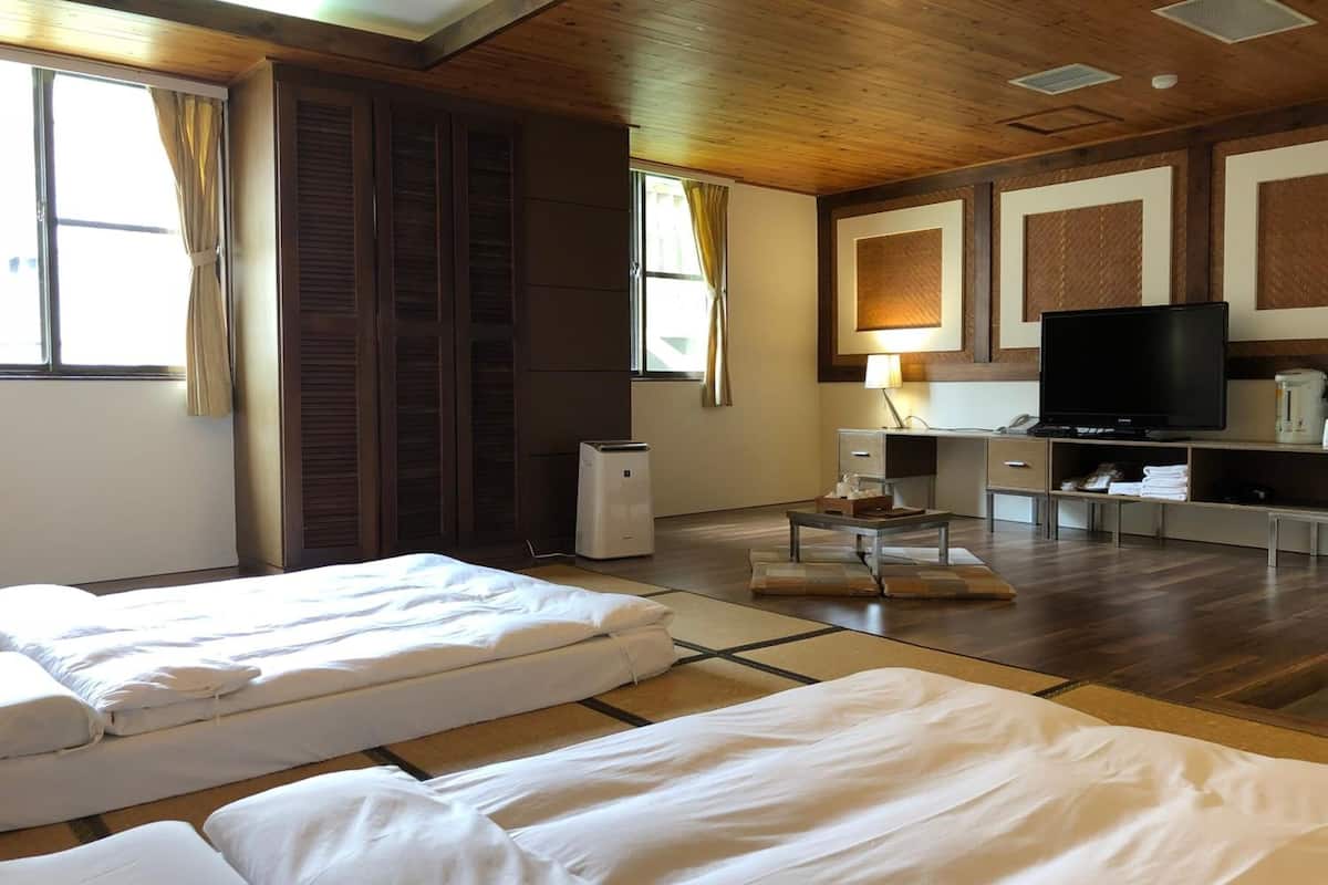 superior quadruple room | blackout curtains, free wifi, bed sheets