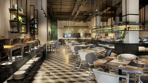A restaurant with a long counter, multiple seating areas, and a checkered floor. - The Zuri Palembang (Palembang)