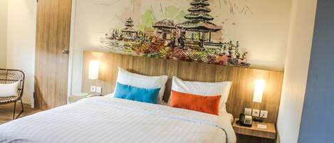A hotel room with a bed, two bedside lamps, a wooden headboard, and a wall mural.