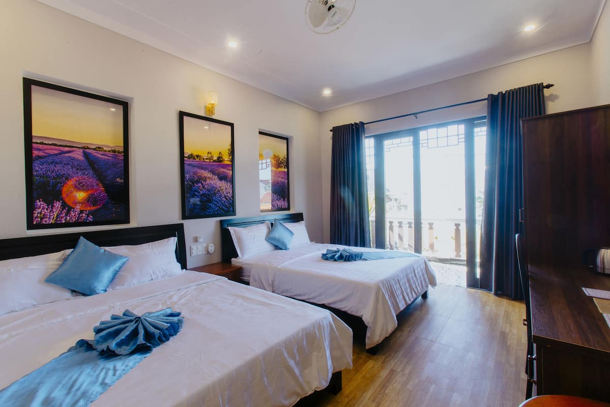 Deluxe Quadruple Room, 2 Queen Beds, Balcony, City View | Premium bedding, minibar, in-room safe, desk