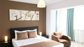 Apartment, 1 Bedroom | 1 bedroom, in-room safe, soundproofing, iron/ironing board