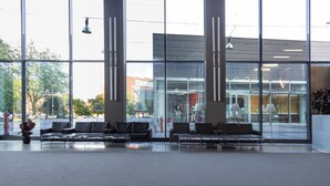 A spacious lobby with large windows, modern furniture, and a clean, contemporary design. - Art Hotel Olympic (Turin)
