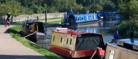 A canal with boats docked along the side.