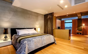 Habitación doble de lujo | Edredón, camas con pillow-top, escritorio y cortinas blackout
