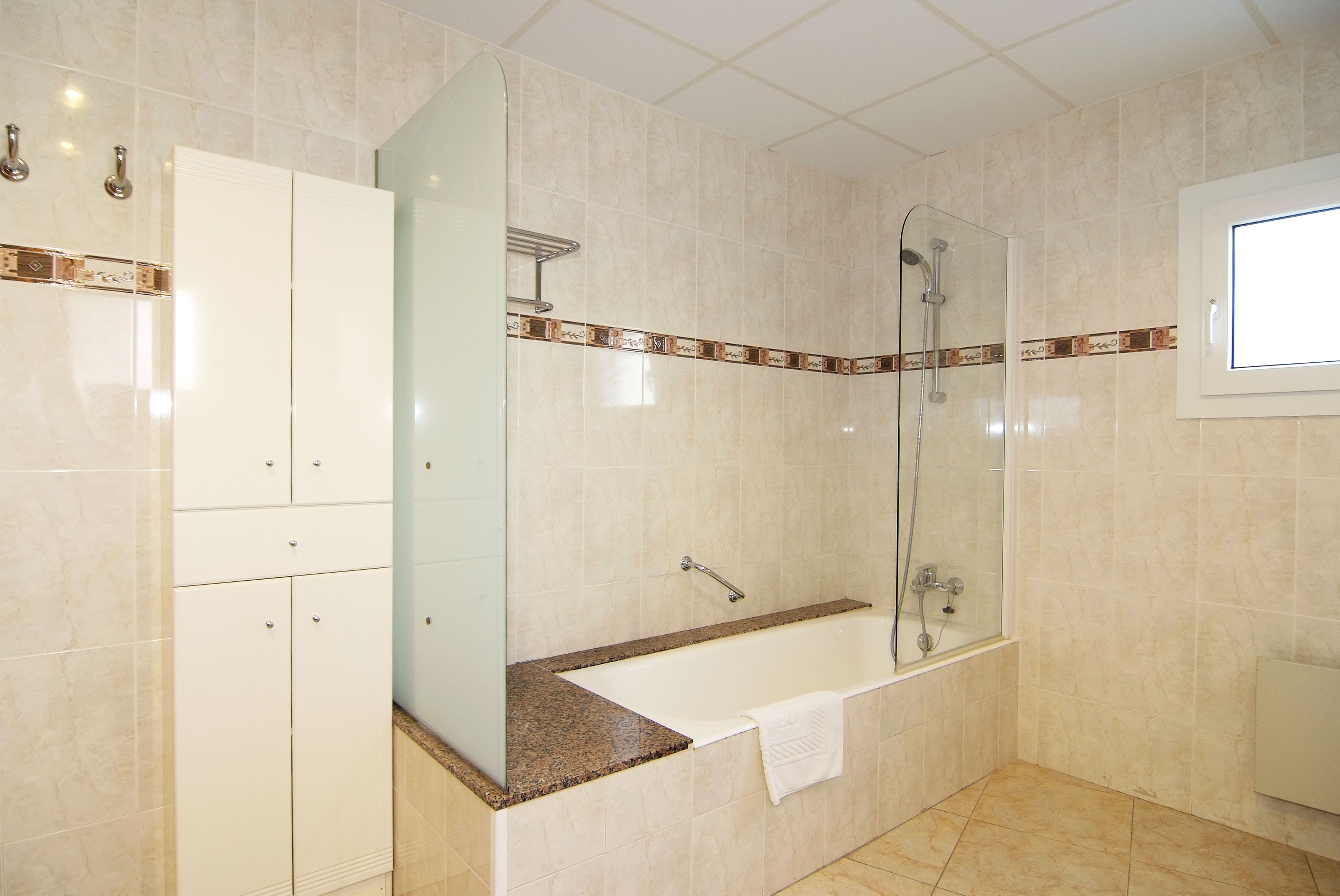 family room | bathroom | bathtub, hair dryer, bidet, towels