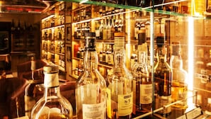 A bar with various bottles of liquor on shelves. - Hotel Forellenhof (Bundenbach)