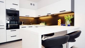 Apartment (Solna 11/C/105) | Private kitchen | Fridge, microwave, stovetop, high chair