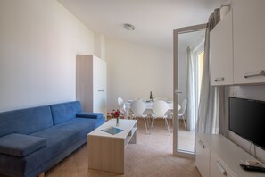 Standard Apartment, 2 Bedrooms, Balcony | Living room | 31-inch flat-screen TV with satellite channels, TV - Villas Faro (Umag)