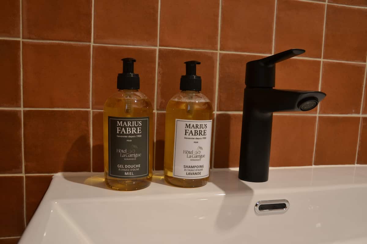Shower, designer toiletries, hair dryer, towels