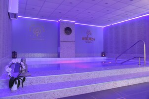 Indoor pool, seasonal outdoor pool, open 8 AM to 8 PM, pool umbrellas