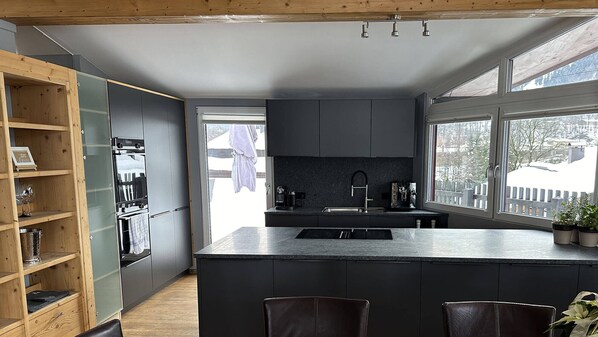 Penthouse | Private kitchen | Fridge, electric kettle, toaster, cookware/dishes/utensils