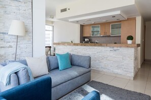 Design Apartment, 1 King Bed, City View, Sea Facing | Living area | Flat-screen TV - HiGuests - Park Island Fairfield (Dubai)