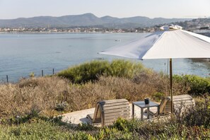 On the beach, sun loungers, beach umbrellas