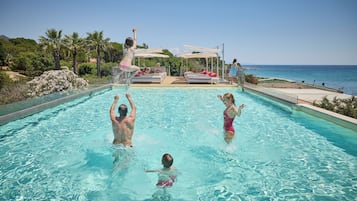 Seasonal outdoor pool, open 9:00 AM to 6:00 PM, pool umbrellas
