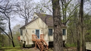 A house with a wooden staircase leading to a door, surrounded by trees. - 2 Bedroom + Loft, 2 bath house in The Galena Territory. (Galena)
