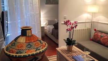 Apartment, 1 Bedroom | Living room | Flat-screen TV