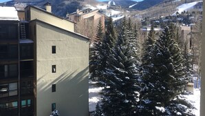 A building with a flat roof and a visible window. - Pristine Condo, Walk To Lifts, 2 Fireplaces, 3 Balconies,  Mountain Views! (Vail)