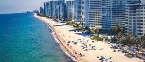 On the beach, sun-loungers, beach towels