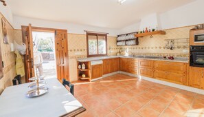 Enjoy cooking in this well-equipped kitchen with oven, sink, and ample counter space.
