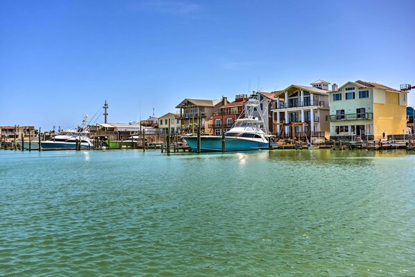 Stunning waterfront marina with boats docked along the pier.