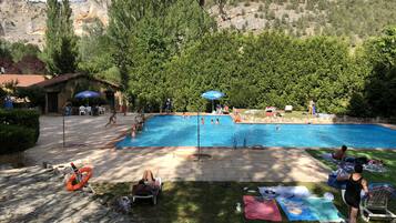 Seasonal outdoor pool, open 11 AM to 8 PM, pool umbrellas, pool loungers