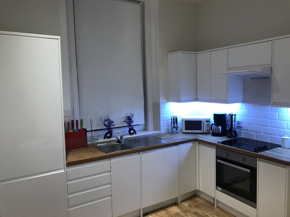 Enjoy cooking in this well-equipped kitchen with a microwave, coffee maker, and oven.