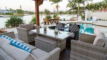 Relax under the Bali Hut blissfully gaze across the pool and north facing water.