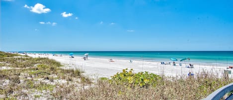 On the beach, sun loungers, beach towels