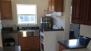 Coffee/tea maker, fridge, stovetop, toaster